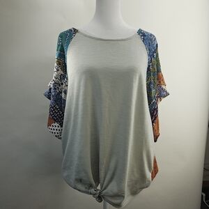Umgee size medium multimedia  blouse. Tie at bottom hem. Multi-color